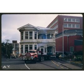 House on trailer being moved (c)