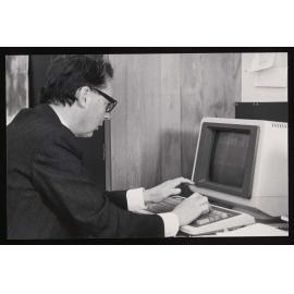 Dr John Harper at a computer