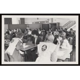 Civil Defence workers registering people in a hall (1)