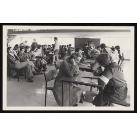 Civil Defence workers registering people  in a hall (2)