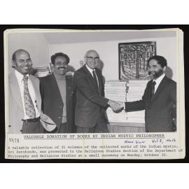 Dr Kapil Tiwari (VUW), Mr Bhattacharjee (Sri Aurobino Society), with Prof Lloyd Geering (VUW) and Mr Deva Rao (Indian High Commissioner) shaking hands