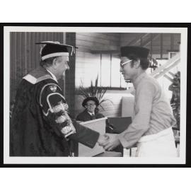 University Chancellor Mr Kevin O'Brien with Malaysian graduate Abdul Amron bin Abdul Assiz