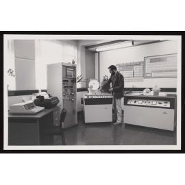 Man in a lab loading samples into the Siemens spectrometer
