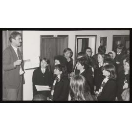 Professor Peter Norrish and a group of students in a hallway