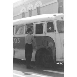 Policeman speaks to driver of Ghana Railways bus on Sophia St, Timaru