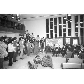 Ngā Tamatoa and Te Reo Māori Society performing a waiata ā-ringa for a Chinese tourist party [1]