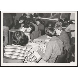 Groups of Architecture students working at tables
