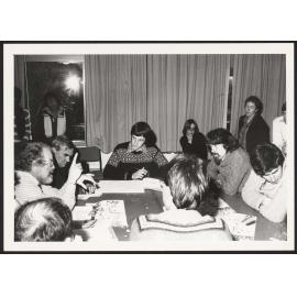 Class discussion around table with Tom Jarman