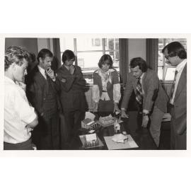 Student model designs being critiqued by professional architects