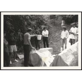 Bill Porteous  demonstrating waterproofing with students