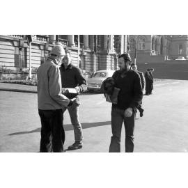 Student handing out anti-war messages at Parliament