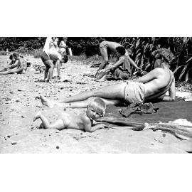 Family on the beach at Curious Cove
