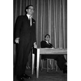 Unknown speaker and Dr Martin Findlay (seated)
