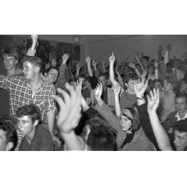 Attendees vote at Victoria University Students' Association meeting on fee increases