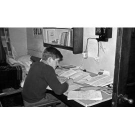Student studying in Weir House bedroom