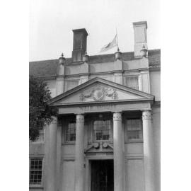 Weir House entrance with rising sun flag