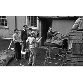 Dr Tim Beaglehole and Weir House residents disposing rubbish