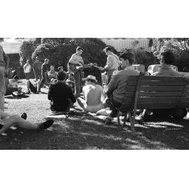 Weir House residents playing guitars on the lawn