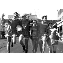 Five students in costume for the annual student procession