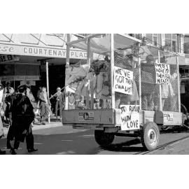 Students in caged trailer for annual procession through Wellington 