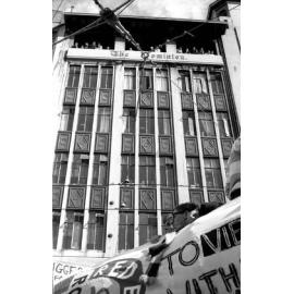 People watching the annual student procession through Wellington from the Dominion Building 