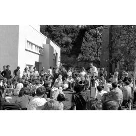 Students gathered outside the Hunter Building listening to a speaker at the weekly student forum [1]