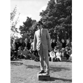 Students gathered outside listening to 'Butler' speak at the weekly student forum